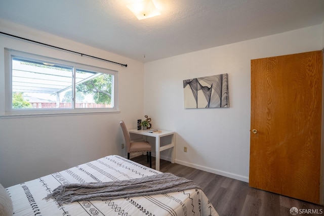 bedroom featuring dark hardwood / wood-style floors