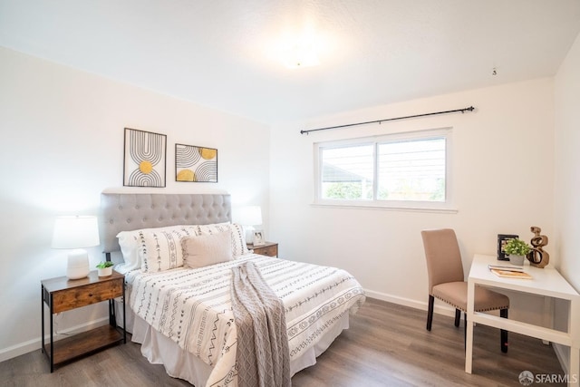 bedroom with hardwood / wood-style floors