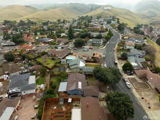 birds eye view of property with a mountain view