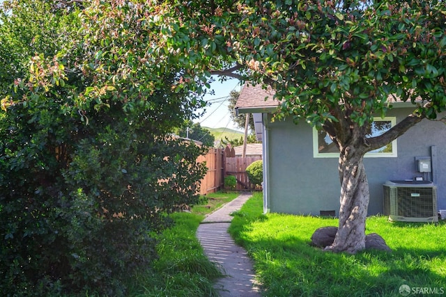 view of yard featuring central air condition unit