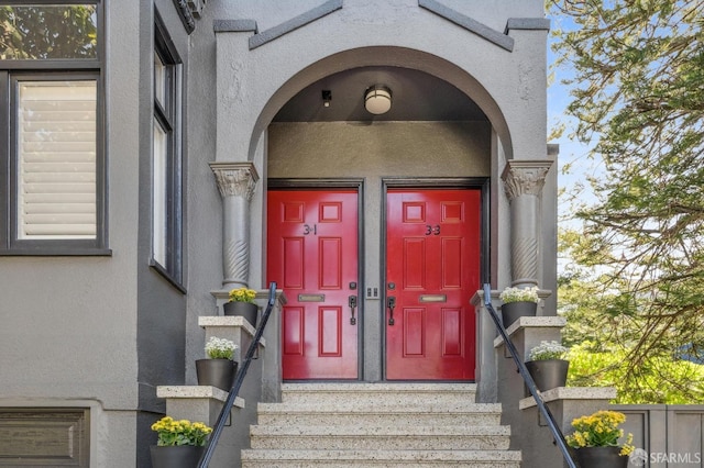 property entrance featuring stucco siding