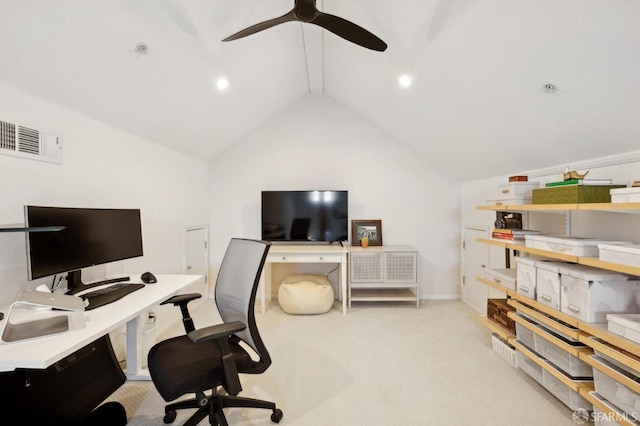 carpeted office space featuring vaulted ceiling and ceiling fan