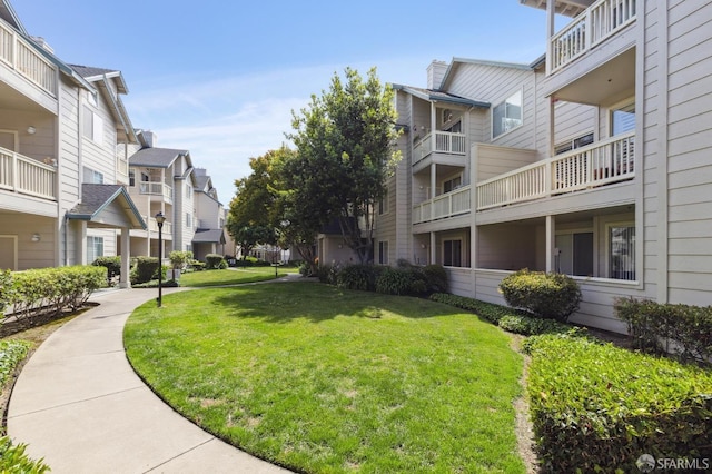 view of community featuring a yard