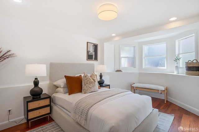 bedroom featuring recessed lighting, wood finished floors, and baseboards