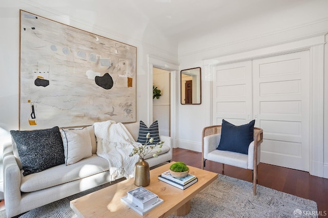 living room with baseboards and wood finished floors