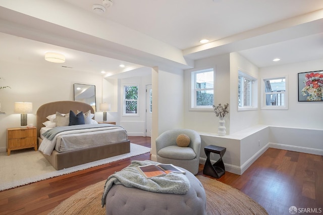 bedroom with baseboards, wood finished floors, and recessed lighting