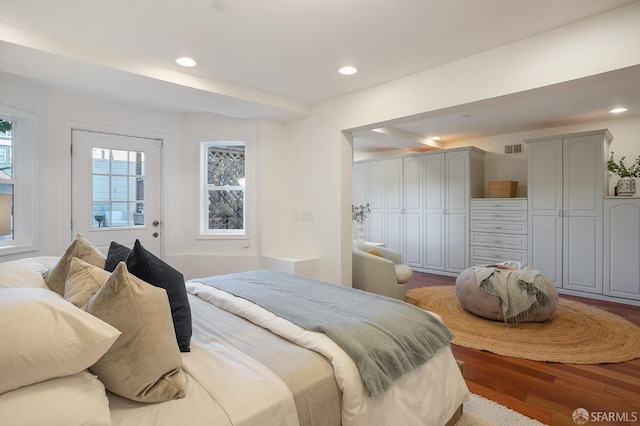 bedroom with wood finished floors, visible vents, and recessed lighting