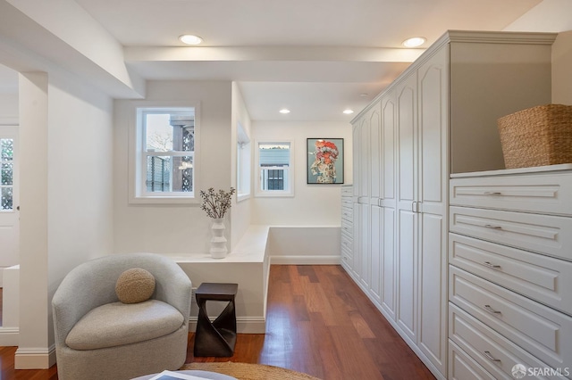 sitting room with baseboards, dark wood-type flooring, and recessed lighting