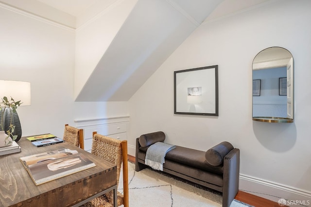 office area with lofted ceiling, baseboards, and wood finished floors