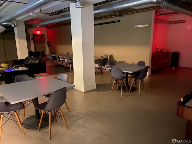 dining area featuring concrete floors