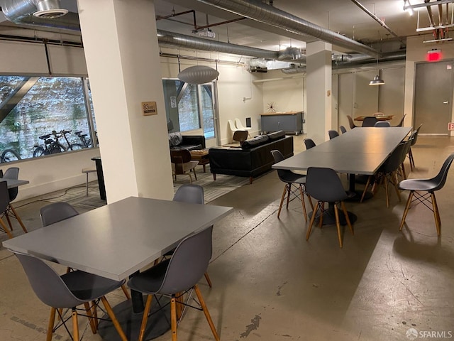 dining room featuring concrete flooring