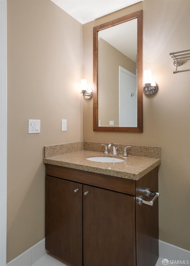 bathroom with tile patterned flooring and vanity