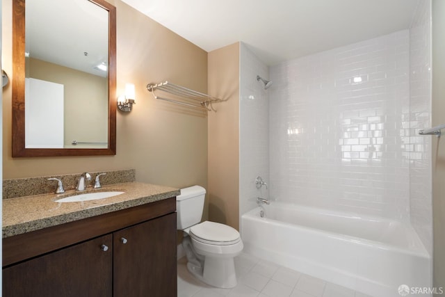 full bathroom featuring tile patterned flooring, vanity, toilet, and tiled shower / bath