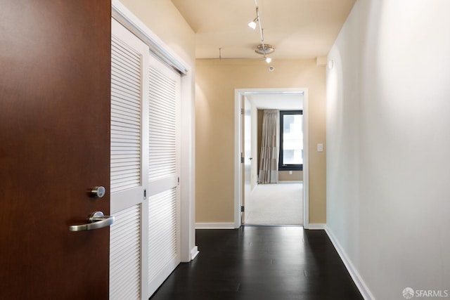 hallway featuring dark wood-type flooring