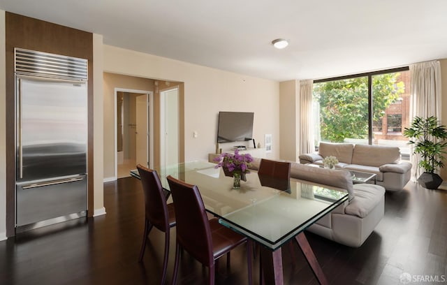 dining room with dark hardwood / wood-style floors