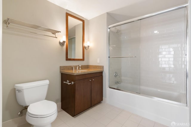 full bathroom with tile patterned floors, combined bath / shower with glass door, vanity, and toilet