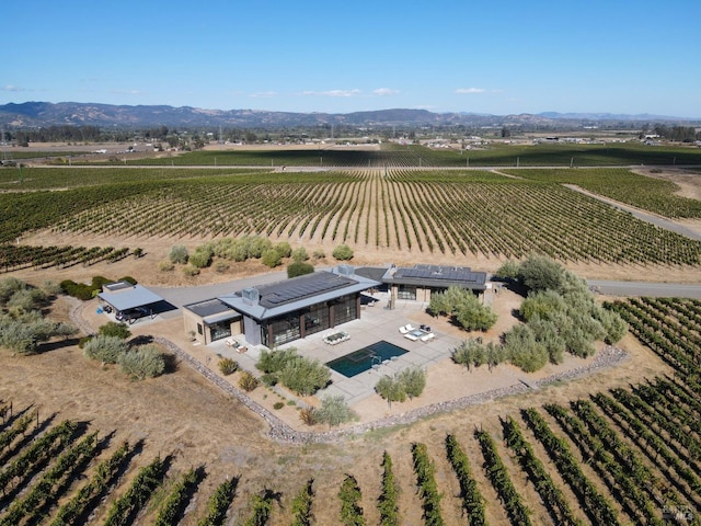 bird's eye view with a mountain view and a rural view