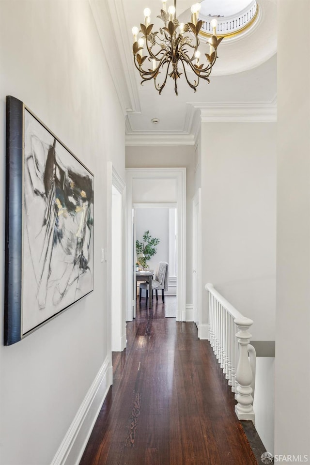 436 Page St, San Francisco, CA 94102 - corridor with a chandelier, crown molding, wood finished floors, an upstairs landing, and baseboards