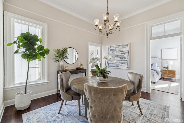 436 Page St, San Francisco, CA 94102 - dining room featuring a chandelier, wood finished floors, baseboards, and crown molding