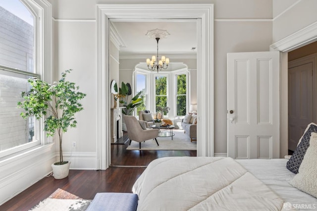 436 Page St, San Francisco, CA 94102 - bedroom with multiple windows, a chandelier, wood finished floors, and ornamental molding