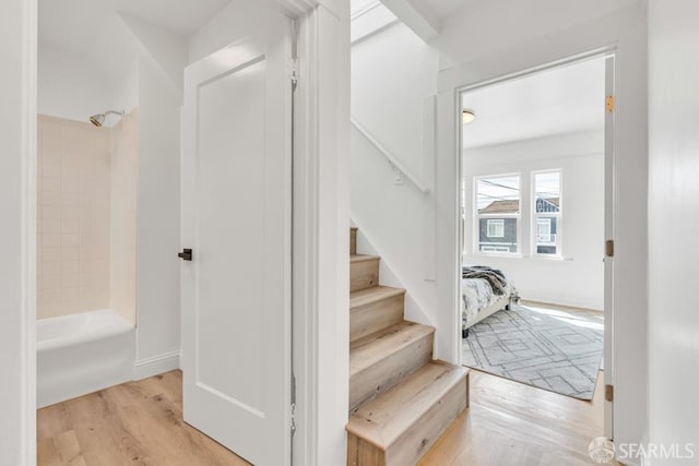 stairs with wood finished floors