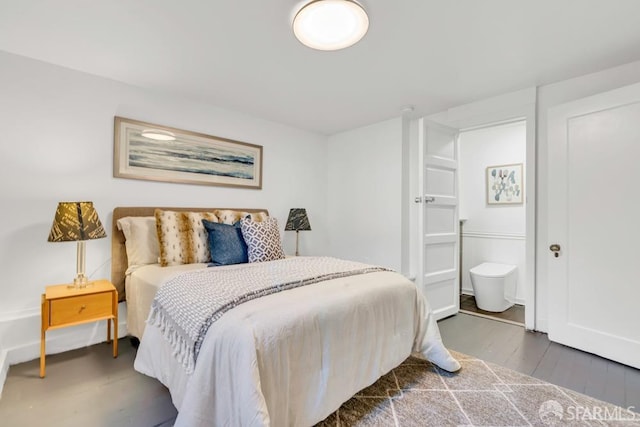 bedroom with wood finished floors