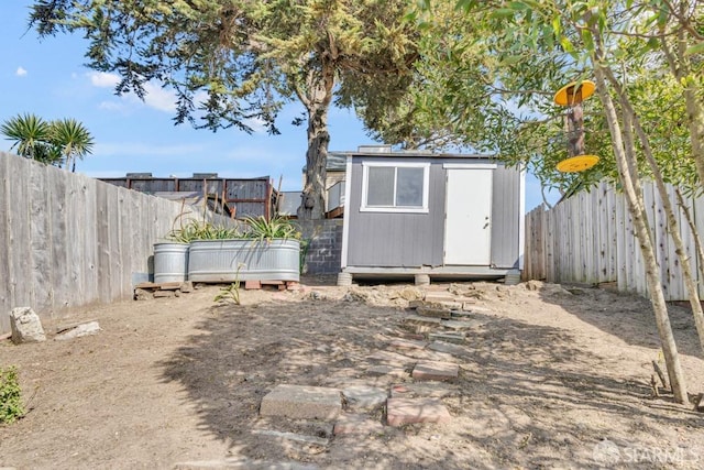 view of shed with a fenced backyard