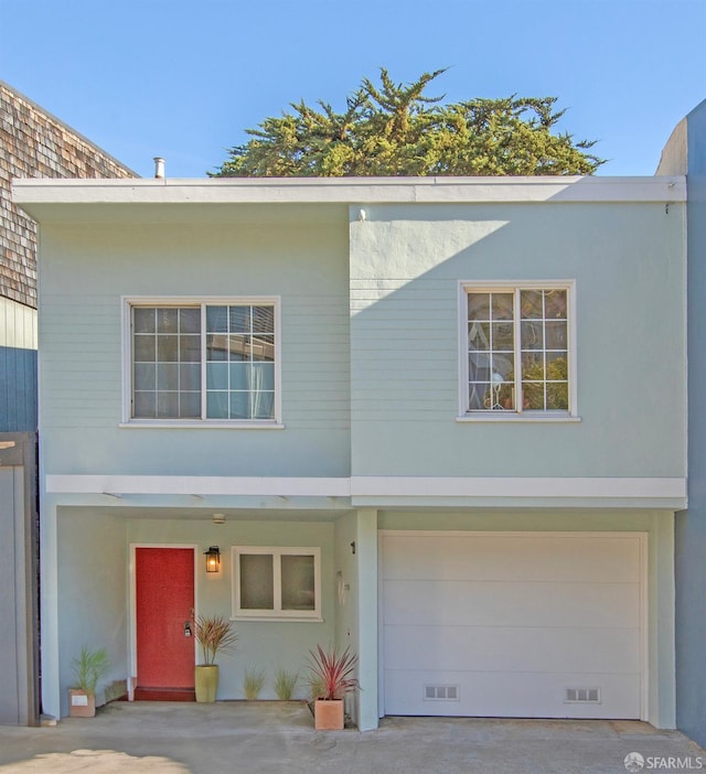 view of front of home with a garage