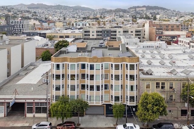 birds eye view of property featuring a mountain view