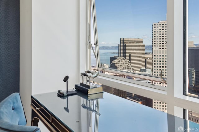 interior space with a view of city and a water view