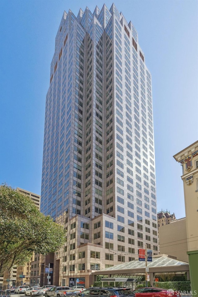 view of building exterior with a parking lot