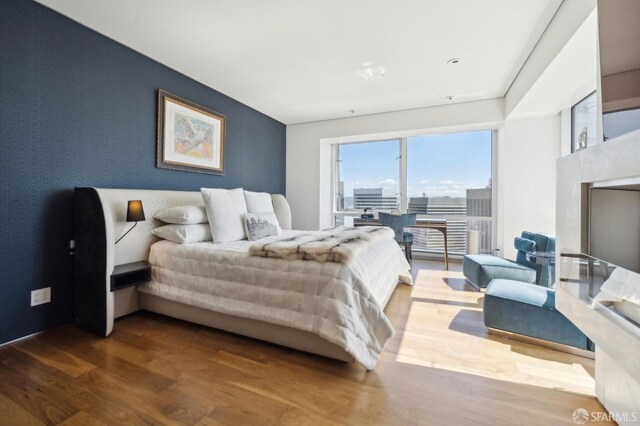 bedroom featuring wood finished floors