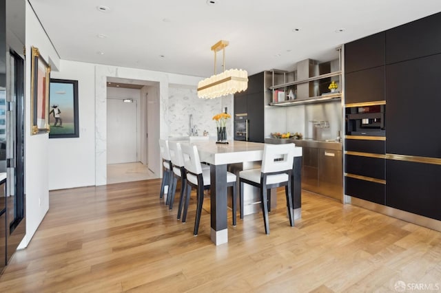 dining room featuring light wood-style flooring