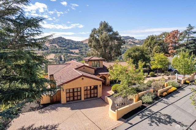 mediterranean / spanish house with a mountain view