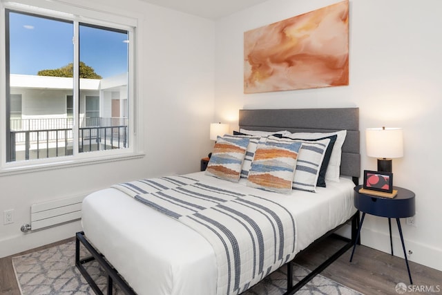 bedroom with hardwood / wood-style floors