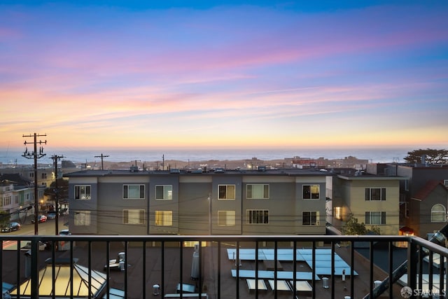 view of balcony at dusk