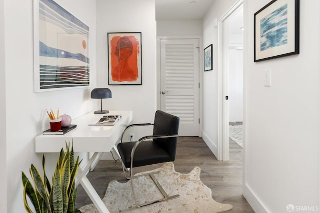 office with hardwood / wood-style flooring