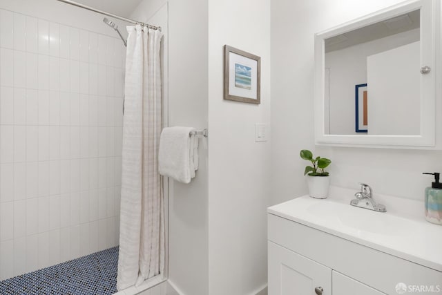 bathroom featuring vanity and a shower with shower curtain