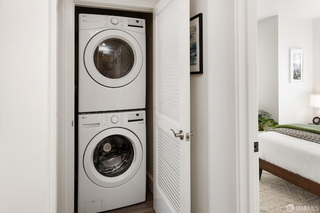 washroom with stacked washer / dryer