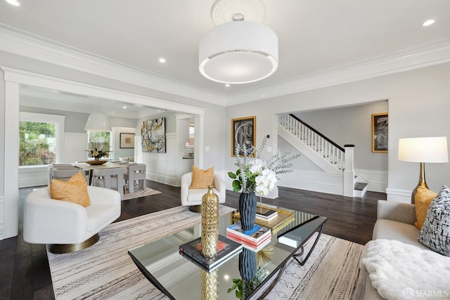 living room featuring crown molding and hardwood / wood-style flooring