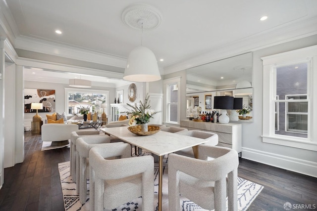 dining room with crown molding and dark wood-type flooring