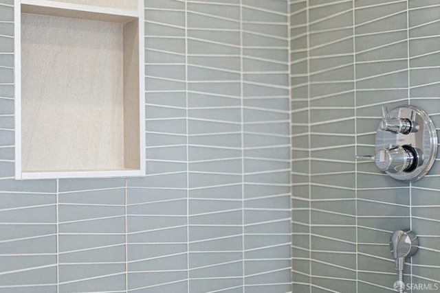 room details with a tile shower