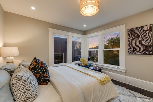 bedroom with hardwood / wood-style floors