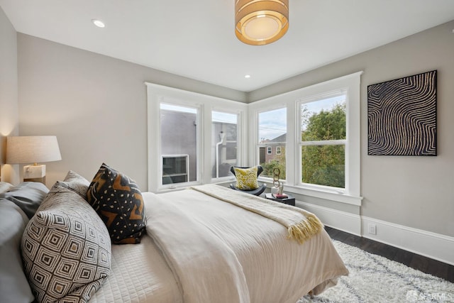 bedroom with hardwood / wood-style flooring