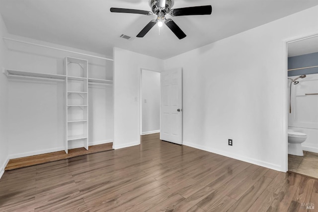 1607 California Dr, Vacaville, CA 95687 - unfurnished bedroom with a closet, wood finished floors, ensuite bath, and a ceiling fan