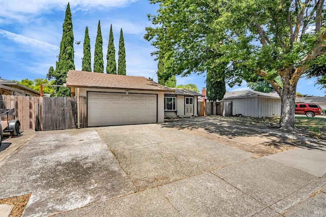 1607 California Dr, Vacaville, CA 95687 - view of front facade with concrete driveway, a garage, and stucco siding