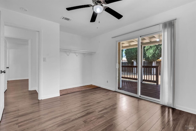 1607 California Dr, Vacaville, CA 95687 - unfurnished bedroom featuring access to exterior, a closet, wood finished floors, and a ceiling fan