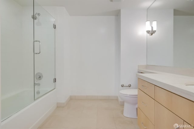 full bathroom featuring toilet, tile patterned flooring, enclosed tub / shower combo, and vanity