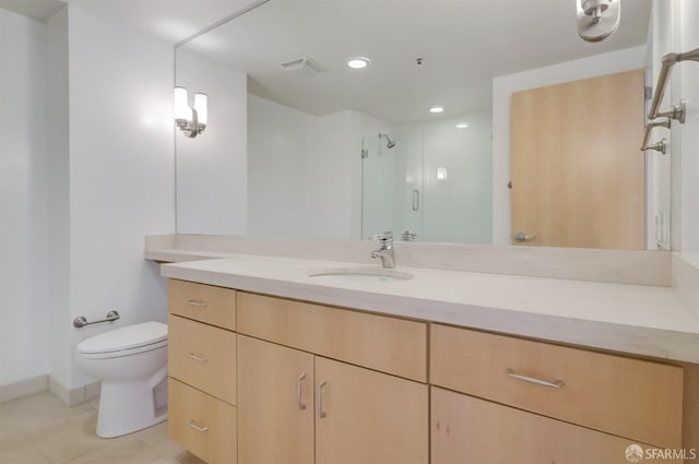 bathroom with tile patterned floors, walk in shower, vanity, and toilet