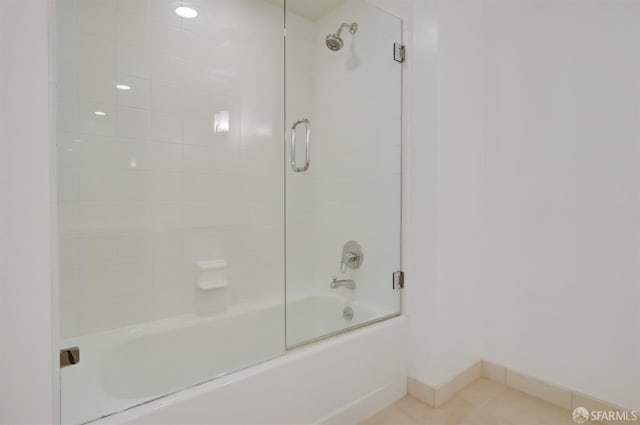 bathroom with enclosed tub / shower combo and tile patterned flooring